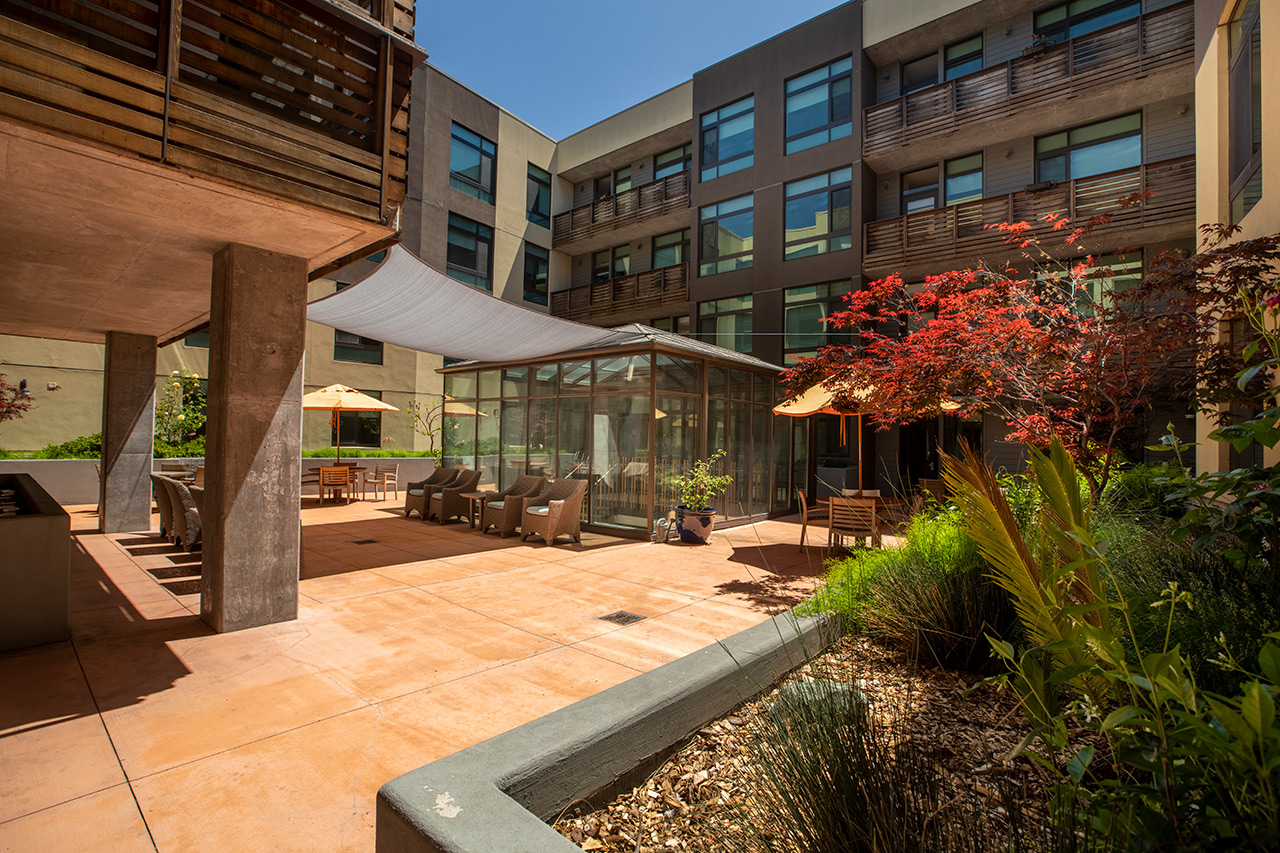 The Watermark By The Bay patio with seating area.