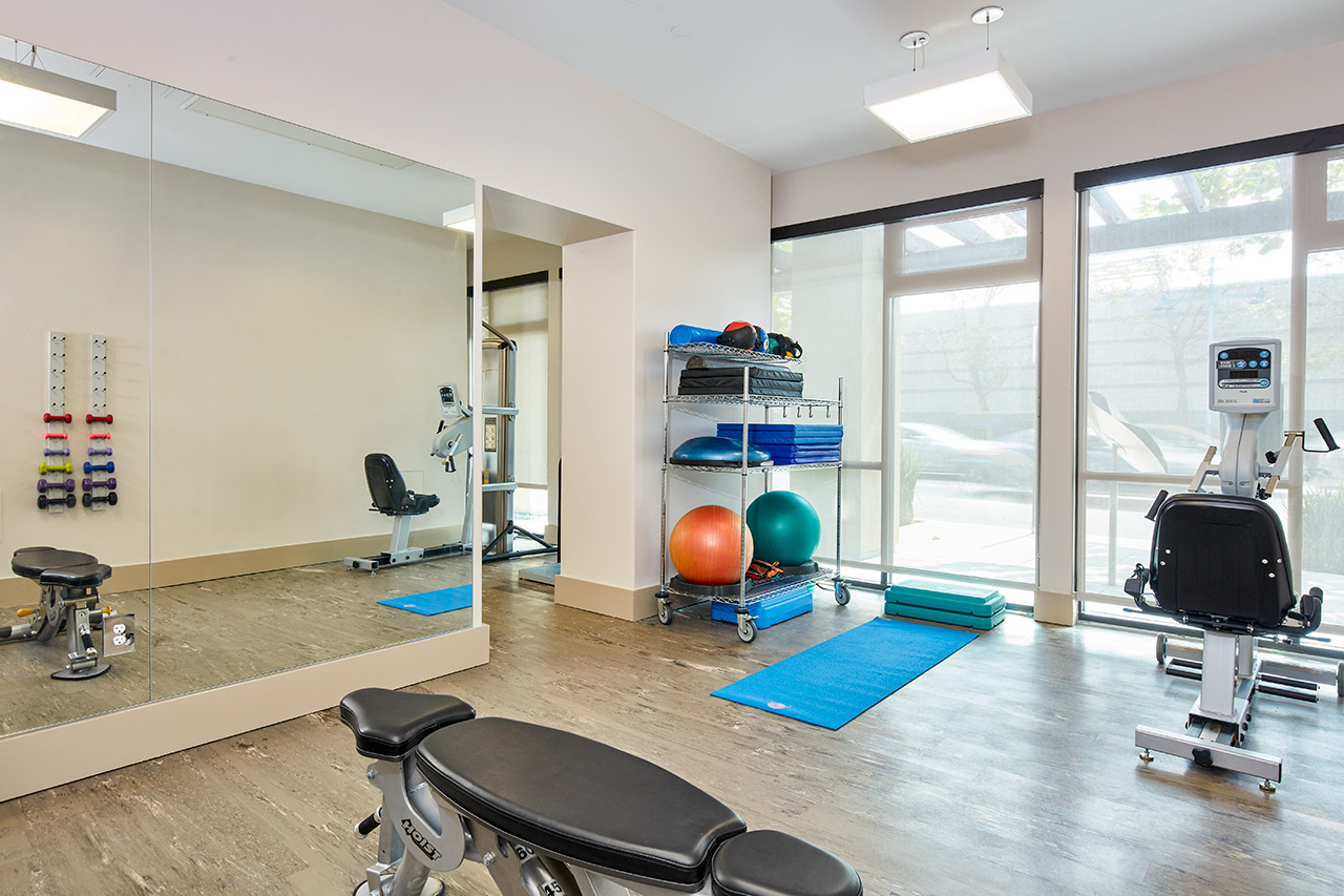 Fitness area with equipment at The Watermark By The Bay.