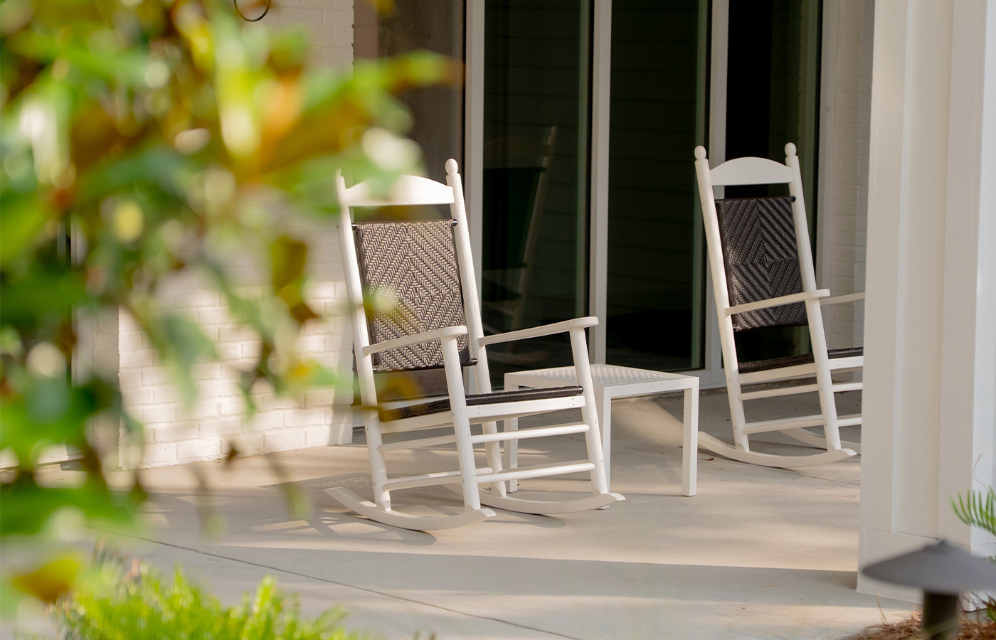 Rocking chairs on a porch.