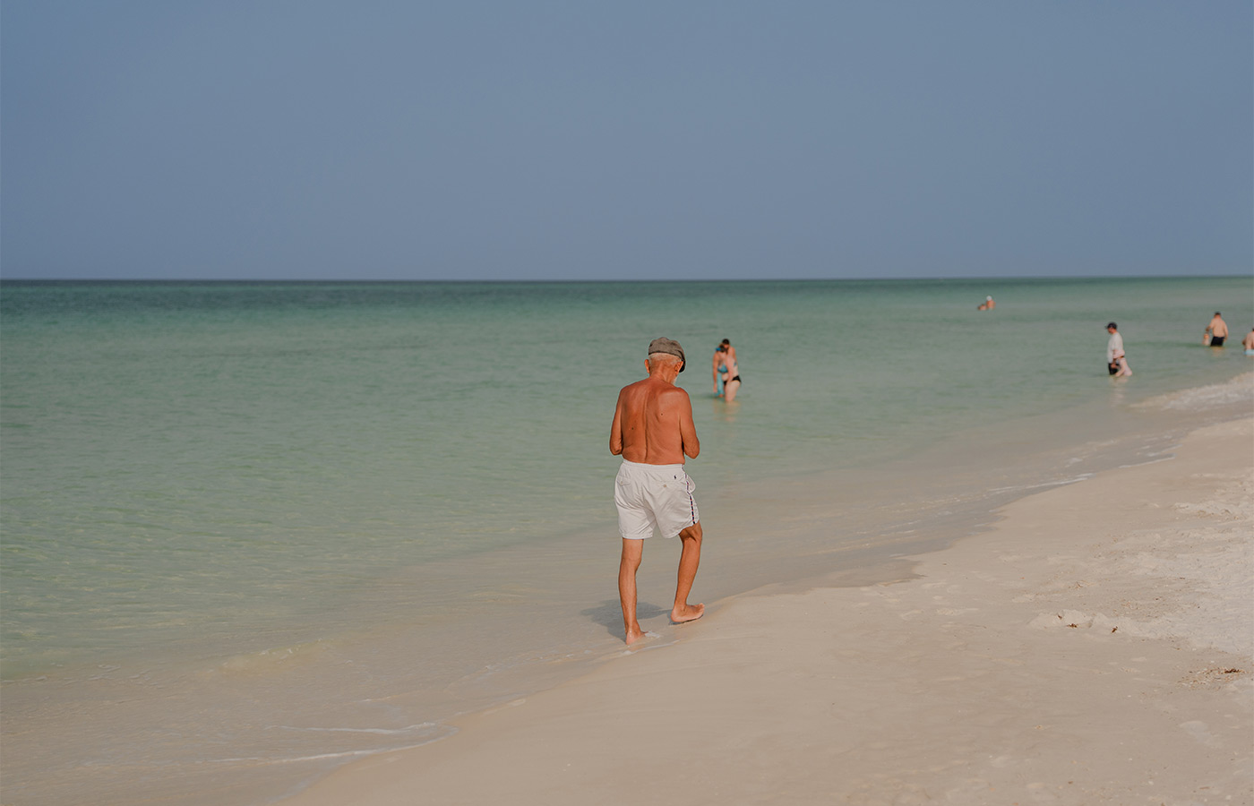 A person walking on the beach.