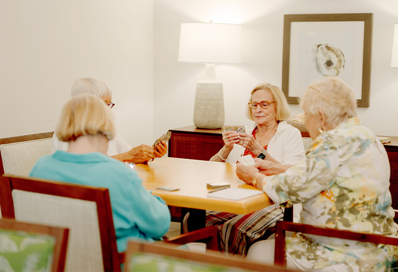 A group of people playing cards.