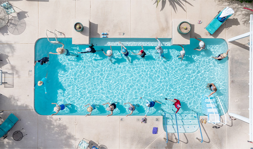 People doing water aerobics in a pool.