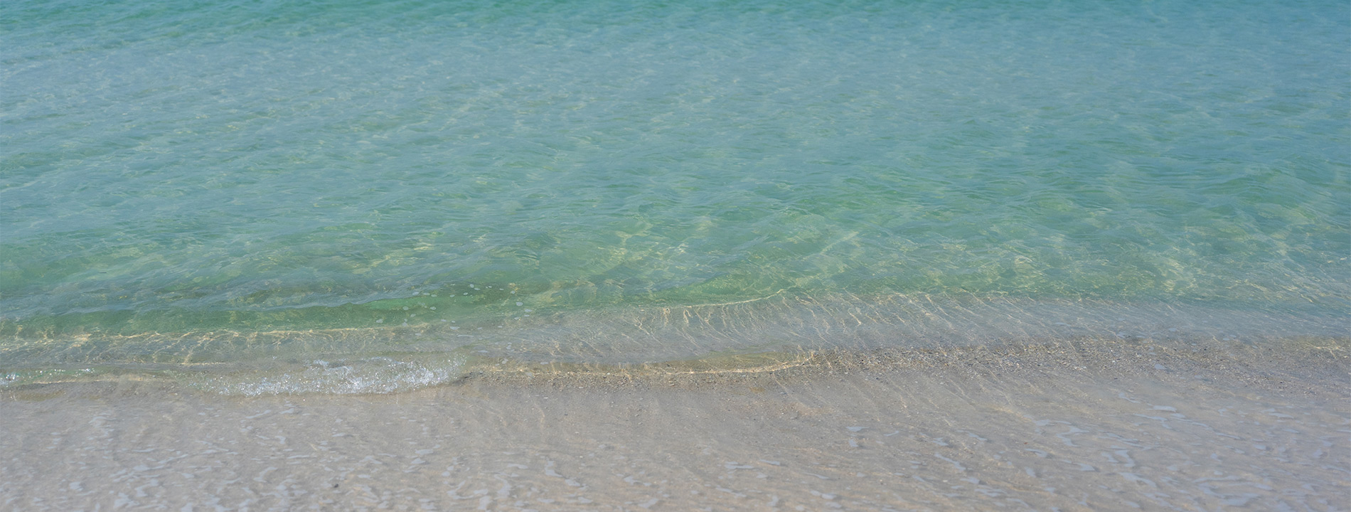 Water rolling up on the beach.