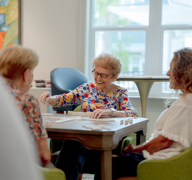 People playing a game and laughing.