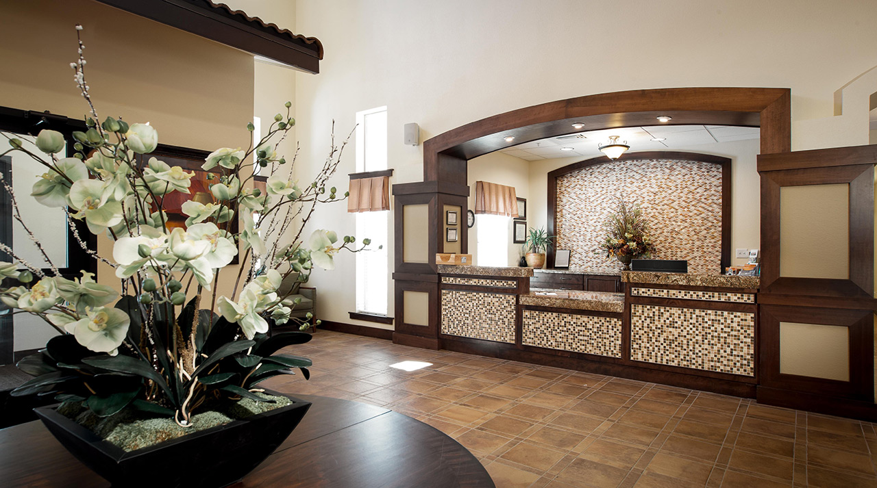 The front desk in the lobby at White Cliffs Senior Living.