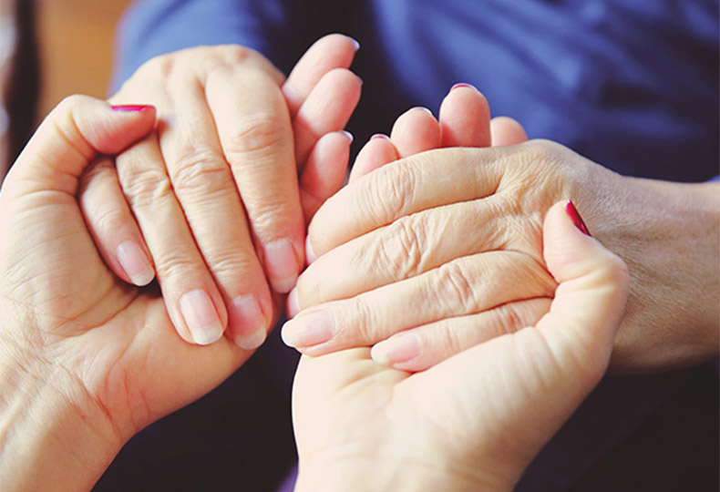 Two people holding hands.