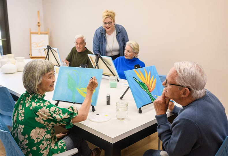 Residents enjoying an art class.