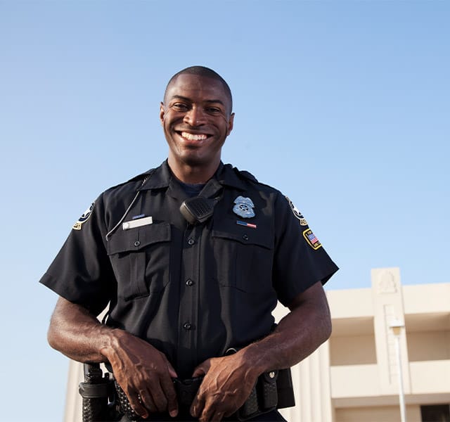 A police officer smiling