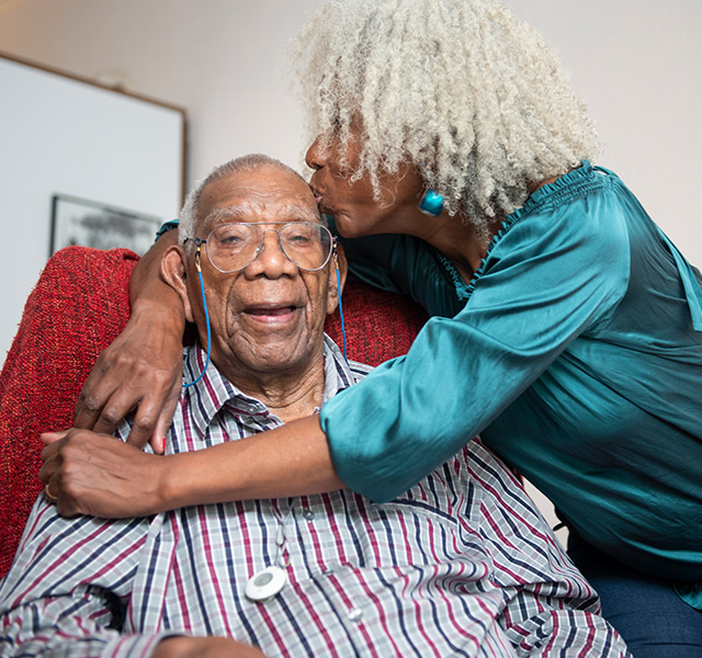 People smiling and embracing.
