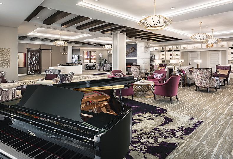 A beautiful lobby with seating and a piano.