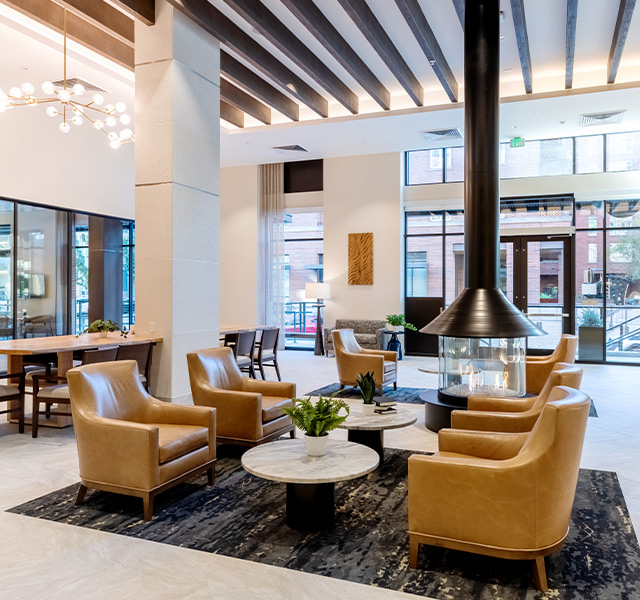 A lobby area with a fireplace.