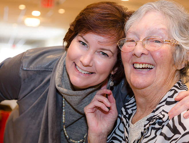 Two residents are smiling.