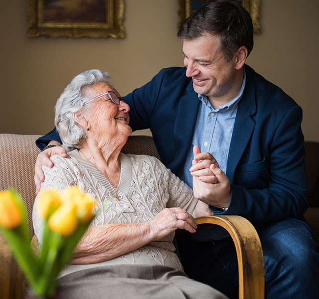 A resident is with their family member.