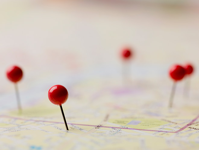 A road map with pins in it.