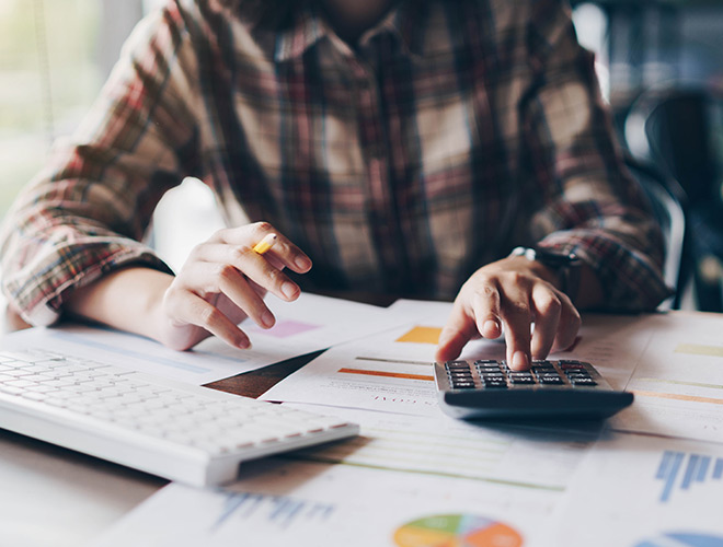 A person is using a calculator.