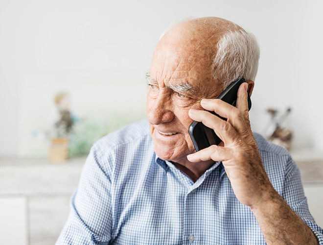 A resident is talking on their cell phone.
