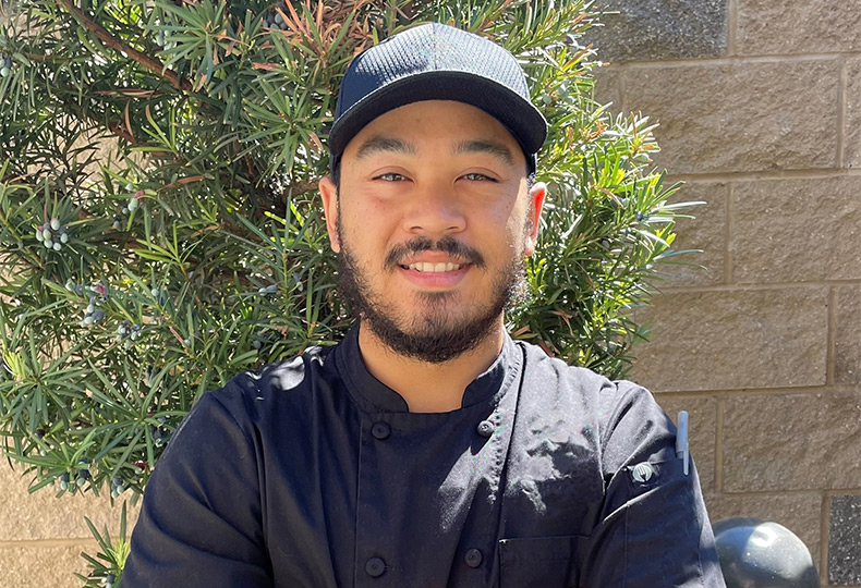 A person outside smiling.