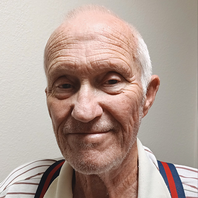 A headshot of a smiling male resident.