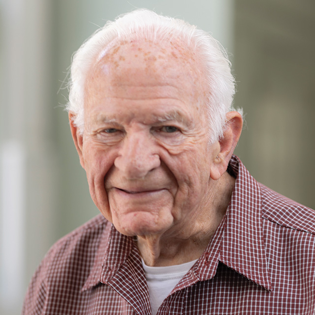 A headshot of a smiling male resident.