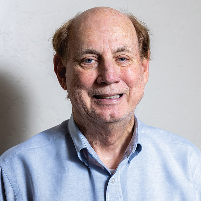 A headshot of a smiling male resident. 