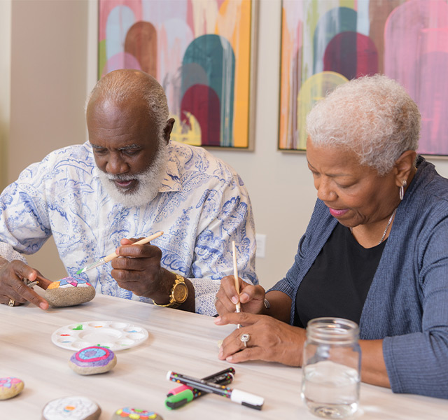 People painting in a class.