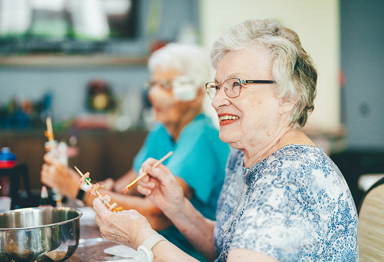 Two residents are painting.