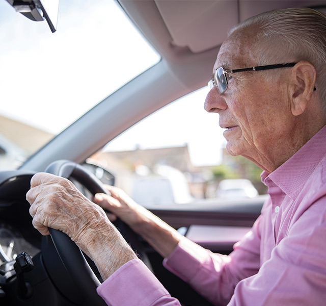 A person driving a car.