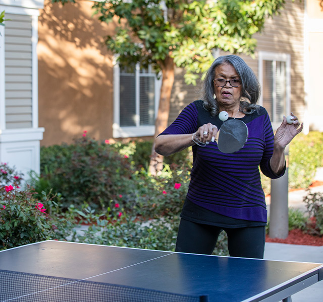 A person playing ping pong.