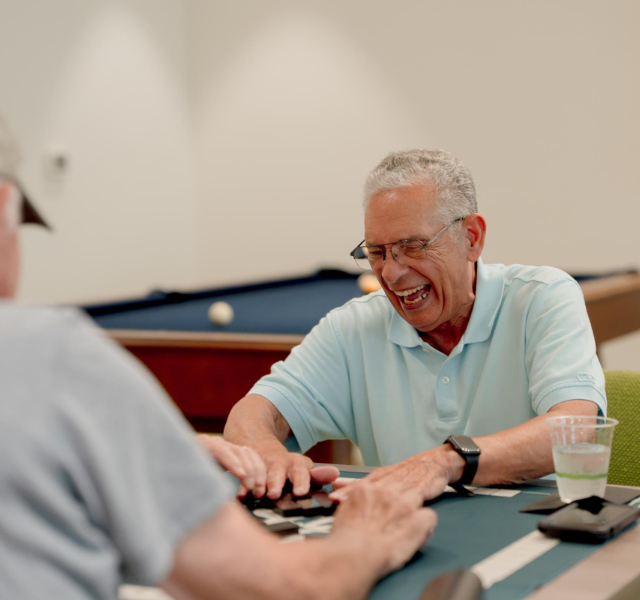 Two people playing a card game.