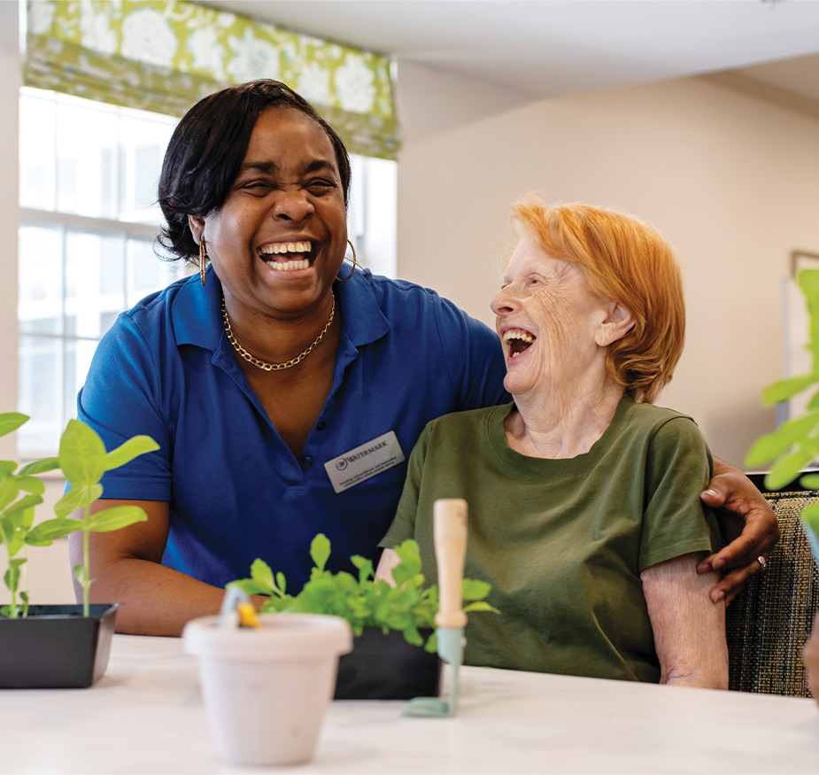 Two people laughing.
