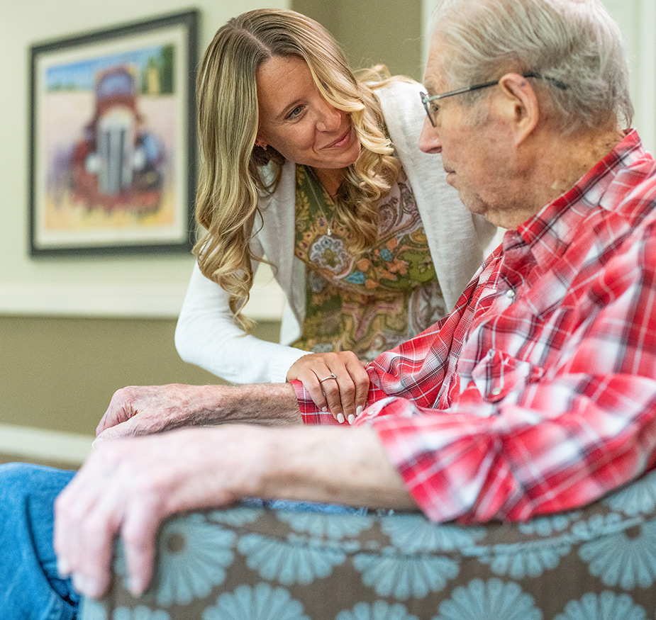 A person comforting another.