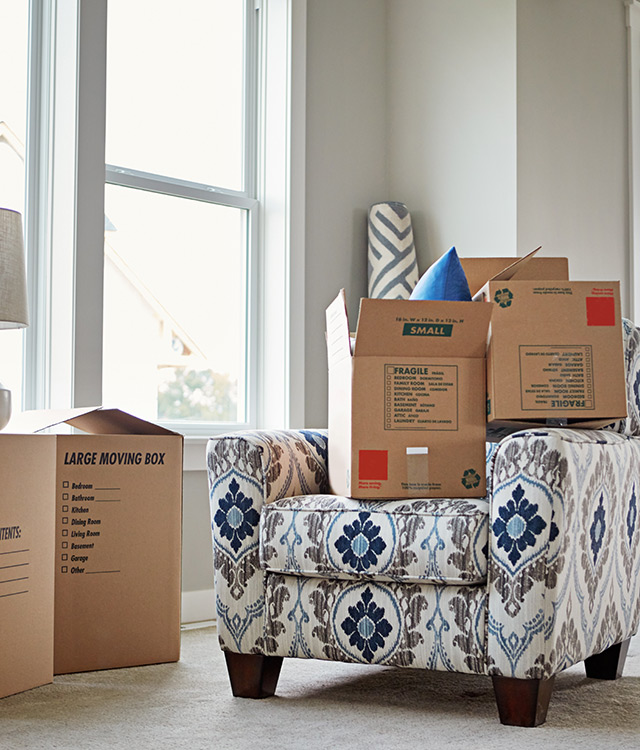 A chair with boxes stacked on top.