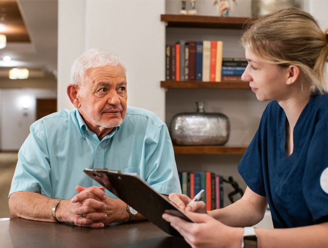 A medical professional helping a resident.