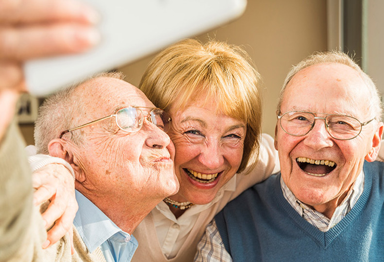 Three people taking a photo together.