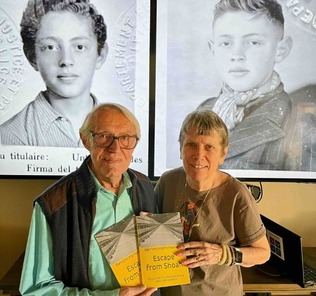 Bernie and his wife holding his book. Escape from Shoah.