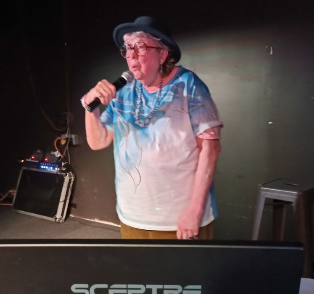 Resident singing karaoke.