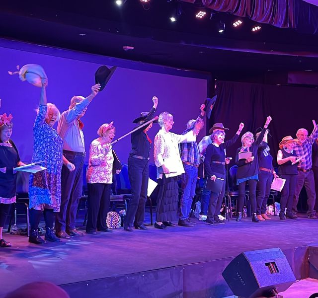 Residents at The Hacienda at the Canyon performing on stage.