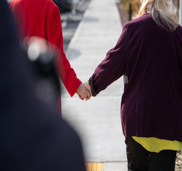 Two people holding hands.