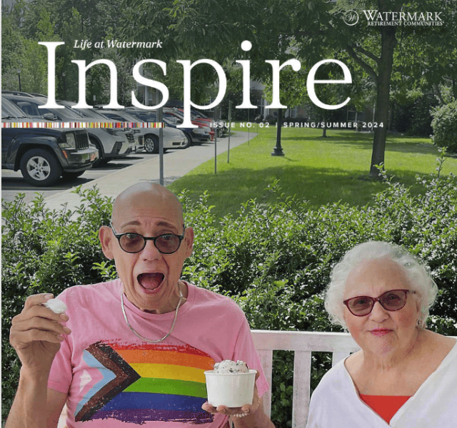 Two residents eating ice cream outside on a bench.