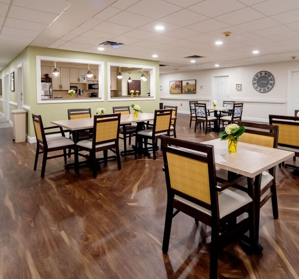 Pathways dining room at Rockland Place. A kitchen, designed to feel like home, is in the background.