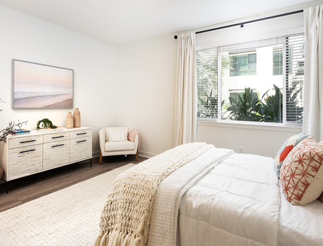 A fully furnished model apartment bedroom.