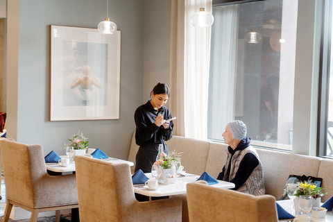 A person taking an order in the restaurant.