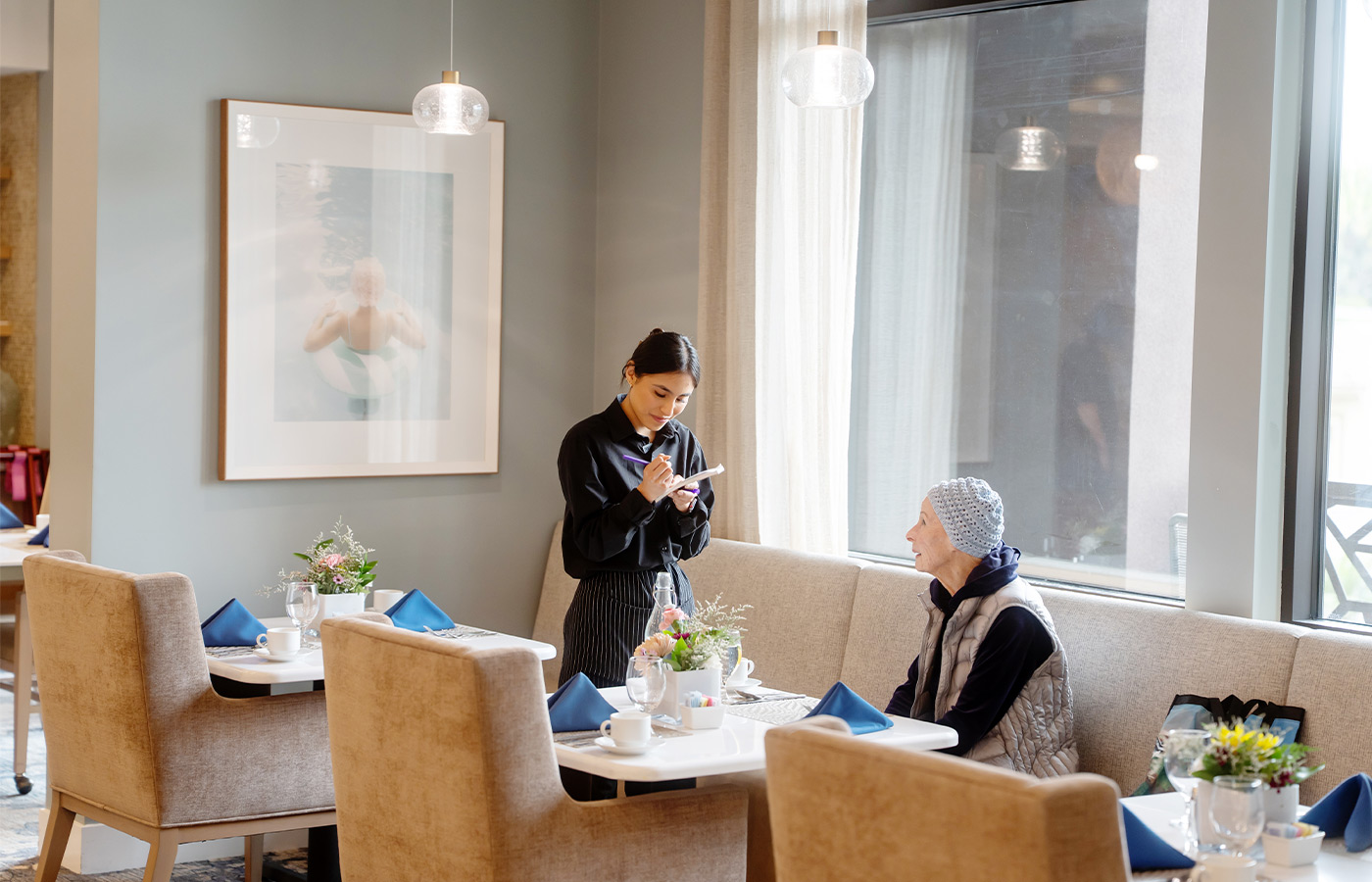 A person taking an order in the restaurant.