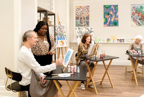 People painting in a class.