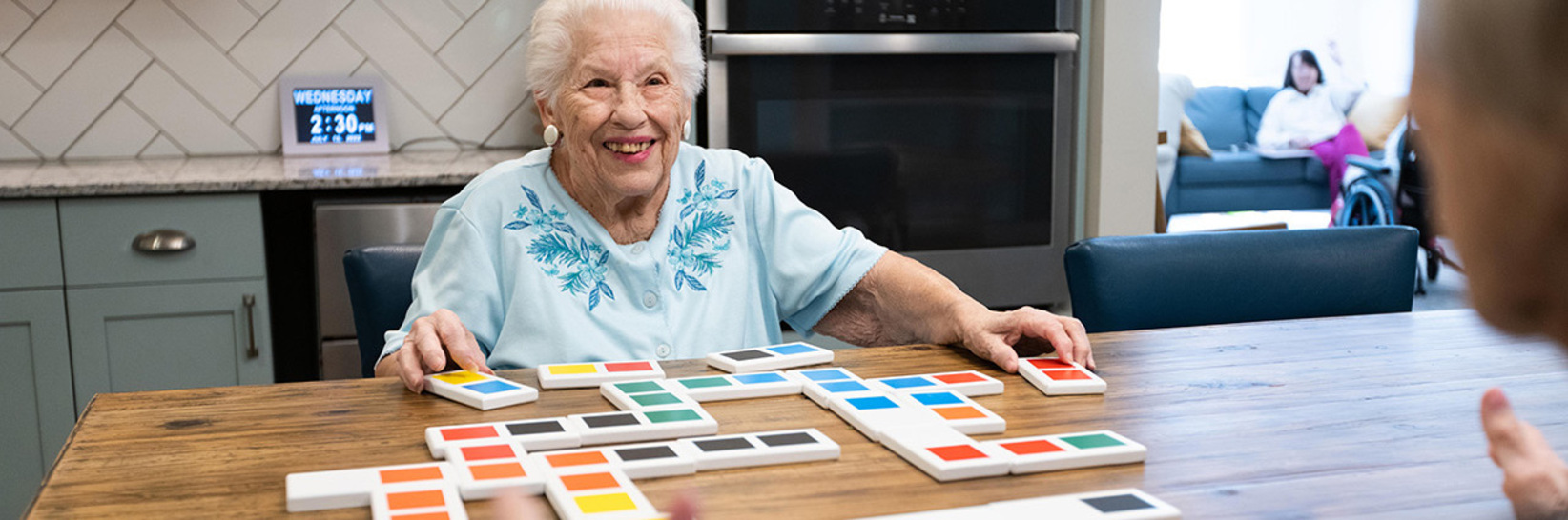 A memory care resident is playing a game in the activity room at East Village Place in East Longmeadow. A memory care resident is playing a game in the activity room at East Village Place in East Longmeadow.