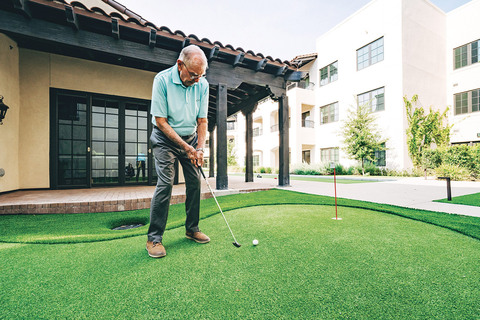 A resident playing golf.
