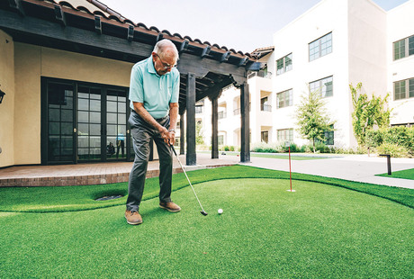 A resident playing golf.