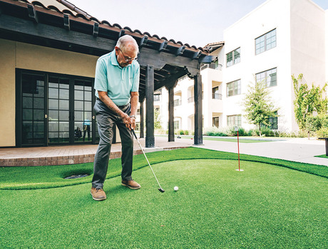 A resident playing golf.