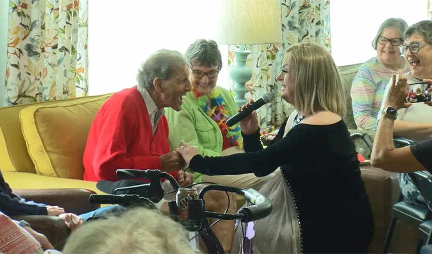 A person singing to a group.