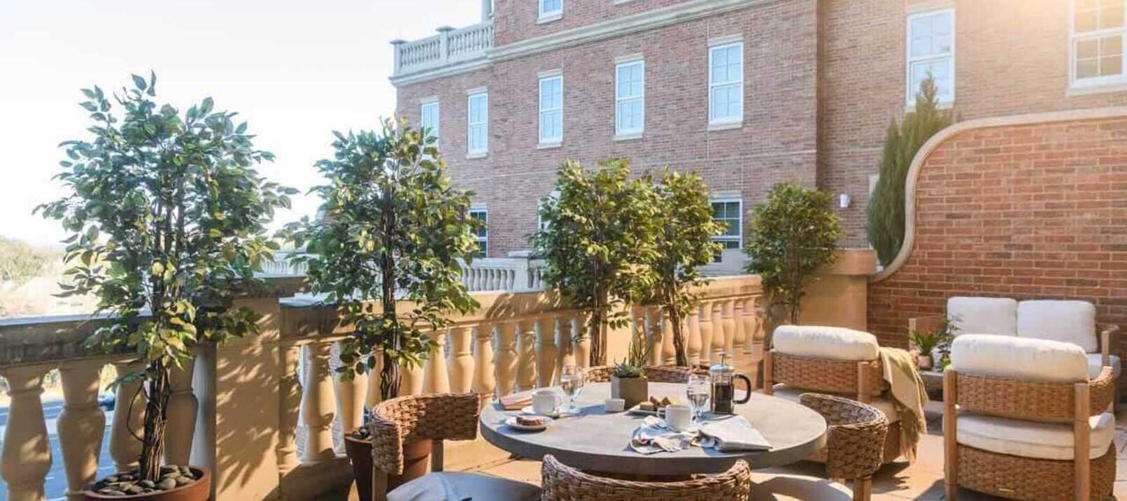 The Preston of The Park Cities outside patio area with tables and chairs